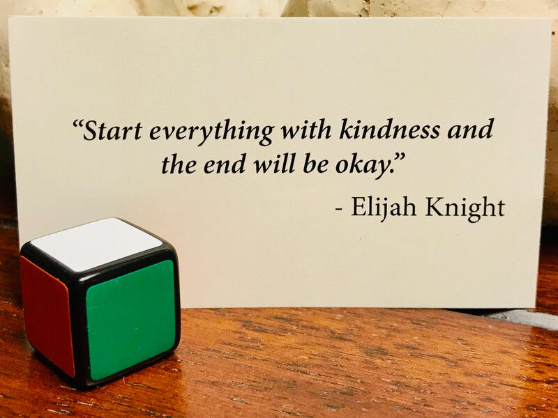 Kindness quote with 1x1 Rubik's cube, solved