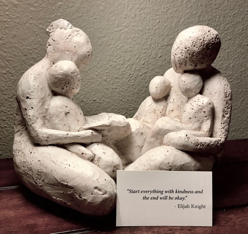 Kindness quote with sculpture