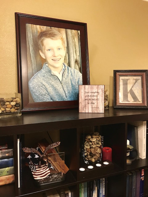 Kindness quote on wood block with Elijah portrait